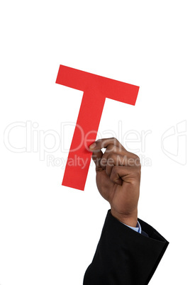 Businessman holding an alphabet t