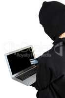 Hacker using laptop and credit card