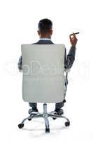 Rear view of businessman holding cigar
