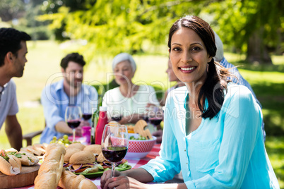 Portrait of beautiful woman having a glass of red wine