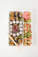 Assorted sushi set served with chopsticks in white box