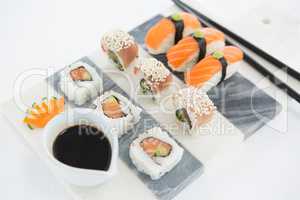 Set of assorted sushi served on gray stone slate