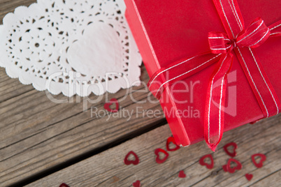 Gift box surrounded with heart shape decoration