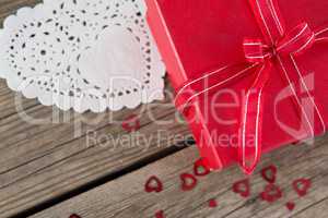 Gift box surrounded with heart shape decoration