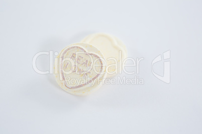 Heart shape confectionery with text real love