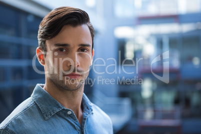 Confident man standing in office