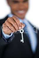 Businessman showing new house key