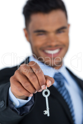 Businessman showing new house key