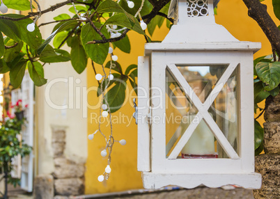 White lantern and leaves