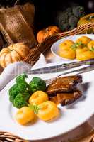 dumplings with pumpkin puree and grilled ribs