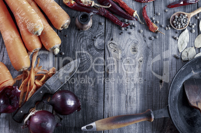 fresh vegetables and spices on gray wooden surface