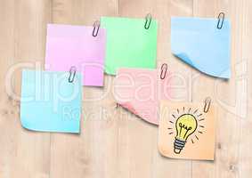 Sticky Notes Bulb Idea Icon against a light wood background