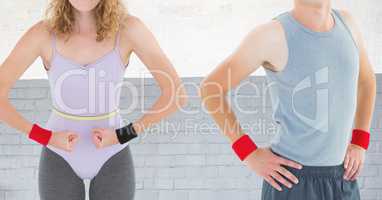 Fitness couple Torso against brick wall