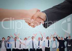 Handshake over business people with blue background