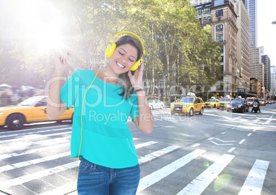 Composite image of Woman in headphones on blue wood panel