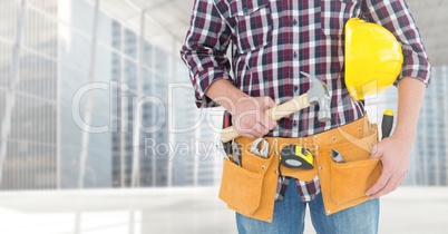 Carpenter with hammer against window