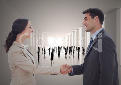 Handshake in corridor with silhouettes