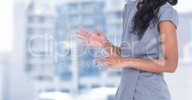 Composite image of Businesswoman Torso against buildings