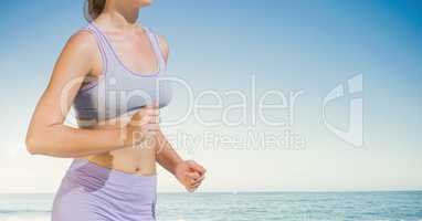 Woman torso who is running on the beach