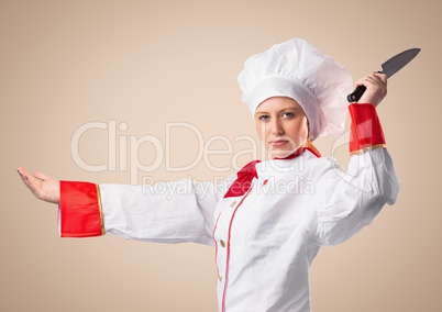 Chef with knife against cream background