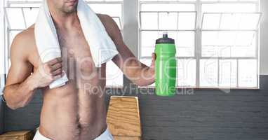 Composite image of man Fitness Torso holding flask