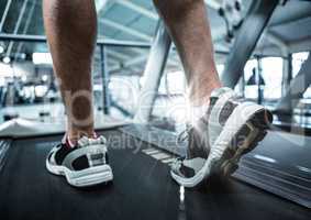 Composite image of feet on treadmill with flare