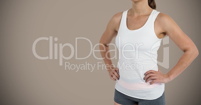 Fitness woman Torso against a neutral brown background