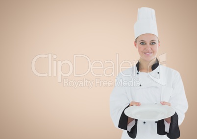 Chef with plate against cream background