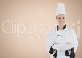 Chef with plate against cream background