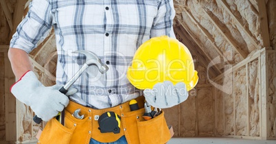Carpenter torso with hammer in building site