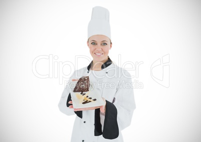 Chef with cake slice against white background