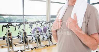 Fitness man Torso with a towel in a gym