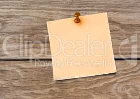 Sticky Note against a wood background