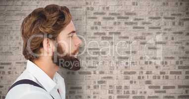 Composite image of Man with beard against brick wall
