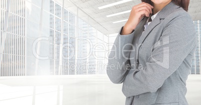 Composite image of Businesswoman Torso against modern place