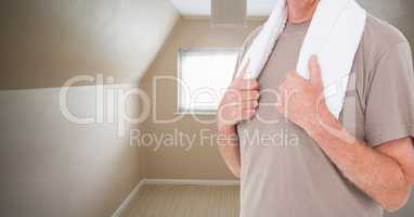 Fitness man Torso with towel in a cream room