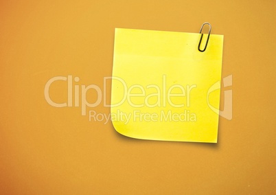 Yellow sticky Note against a neutral orange background