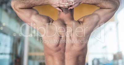 Back view of a Fitness Torso against gym club background