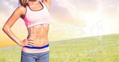 Fitness woman Torso making exercises against countryside background