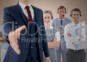 Handshake in front of business people with cream background