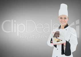 Chef with cake slice against grey background