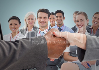 Handshake with business people and blue background