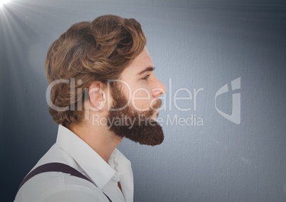 Composite image of Man with beard against navy background with flare