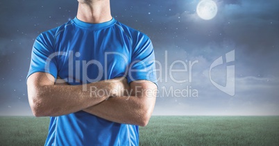 Composite image of man Fitness Torso against landscape by night