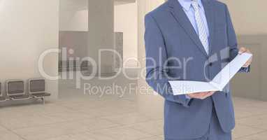 Composite image of Businessman Torso against empty room