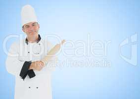 Chef with rolling pin against blue background
