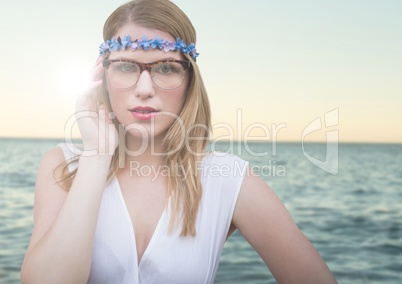 Composite image of Hippie in front of sea with flare