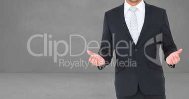 Composite image of Businessman Torso against grey background