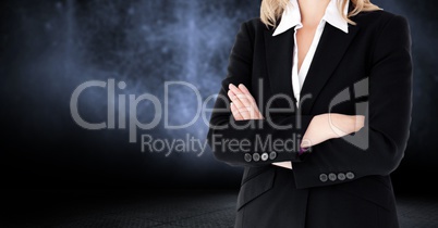 Composite image of Businesswoman Torso against dark background