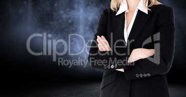 Composite image of Businesswoman Torso against dark background